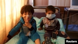Children receive oxygen, after suffering from choking, at a hospital in Taza, south of Kirkuk, in March. Islamic State militants in parts of occupied Iraq are known to have tried to manufacture chemical weapons.