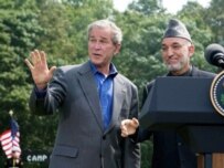 Bush and Karzai speaking at Camp David (AFP)