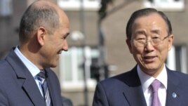 Slovenian Prime Minister Janez Jansa (left) speaks with UN Secretary General Ban Ki-moon upon his arrival in Ljubljana.