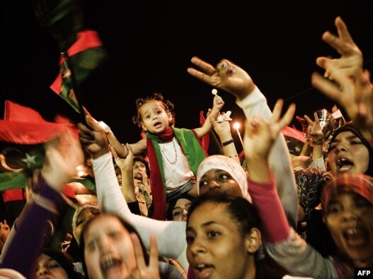 Spontaneous celebrations erupt on the streets of Benghazi after it is announced that Libyan rebels had overrun Muammar Qaddafi's compound in Tripoli. 