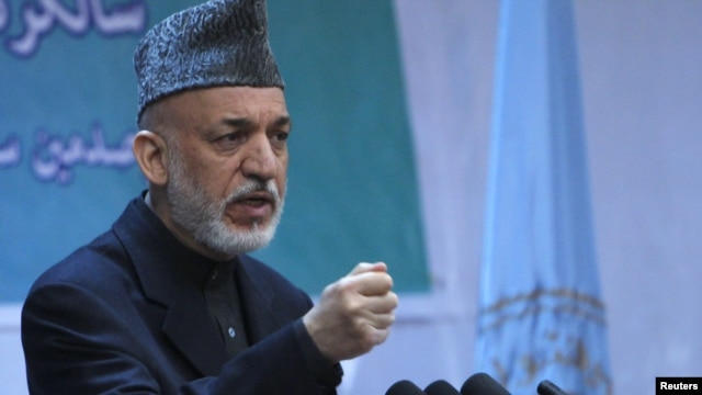 Afghan President Hamid Karzai speaks during a gathering in Kabul on April 17.