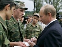 Putin (right) signing autographs for soldiers during a visit to the Southern Federal District on September 26 (epa)