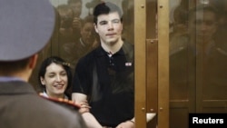 Convicted killers Yevgeniya Khasis (left) and Nikita Tikhonov during their sentencing in a courtroom in Moscow in May 2011.