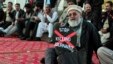 Pakistan -- A journalist holds a placard while taking part in a demonstration in front of the Parliament building in Islamabad, 28Jan2013