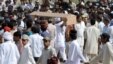 Ahmadi community members carry a coffin during a funeral ceremony in 2010 for victims of a militant attack on one of the sect's prayer halls, which killed some 80 people. According to a new report by the U.S. State Department, the religious minority Ahmadis are still the target of frequent sectarian violence.