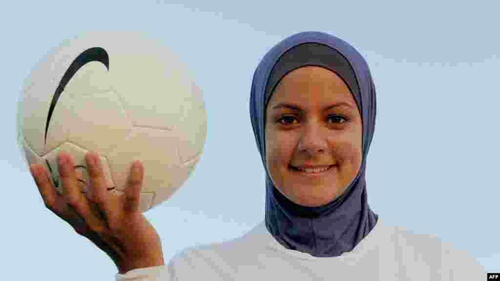 Australian soccer player Assmaah Helal wears a hijab during a training session in Sydney in February. Soccer's rules panel says it wants to approve headscarves, but has yet to find a "safe" design.