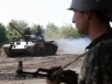 Abkhazian soldiers take part in a tank exercise in Ochamchyra, east from Sukhumi, on May 14