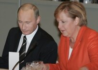 Chancellor Merkel (right) with Putin at an EU gathering in Finland in October (ITAR-TASS)