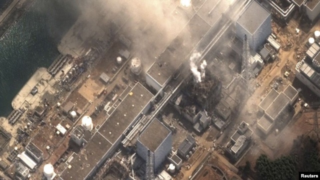 Japan - The No.3 nuclear reactor of the Fukushima Daiichi nuclear plant at Minamisoma is seen burning after a blast following an earthquake and tsunami in this handout satellite image taken 14Mar2011