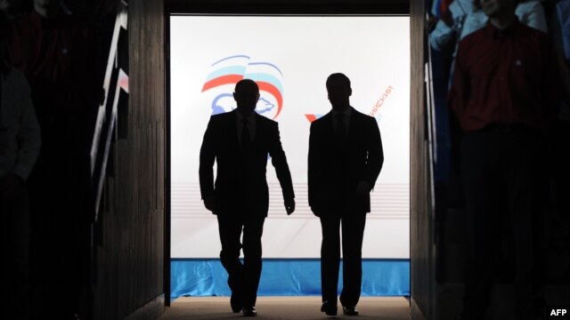 Murky dealings in the corridors of power? At last year's United Russia congress Dmitry Medvedev (right) effectively relinquished the presidency to Vladimir Putin. 