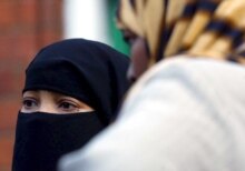 U.K. -- A Muslim woman wears a niqab (full veil) in Birmingham, 26Aug2006