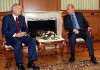 Putin (right) with Karimov in Sochi today (official site)