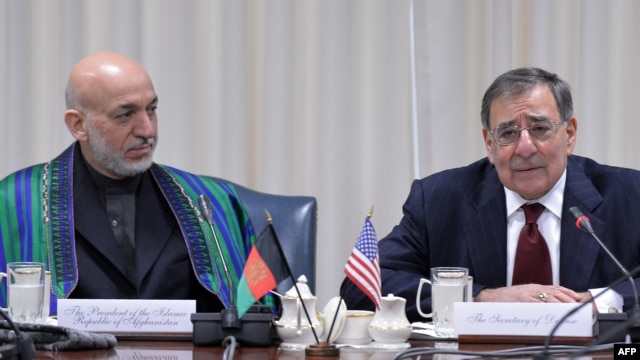 U.S. Defense Secretary Leon Panetta (right) with Afghan President Hamid Karzai during their meeting at the Pentagon.