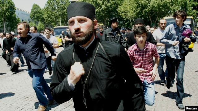 Orthodox clergy and Orthodox Christian activists clashed with gay-rights activists at a rally in Tbilisi marking International Day Against Homophobia on May 17.