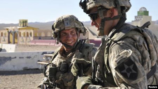 U.S. Staff Sergeant Robert Bales (left) trains at the National Training Center in Fort Irwin, California, in August 2011.