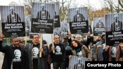 International human rights activists call for Ales Byalyatski's release from prison in this undated photo.