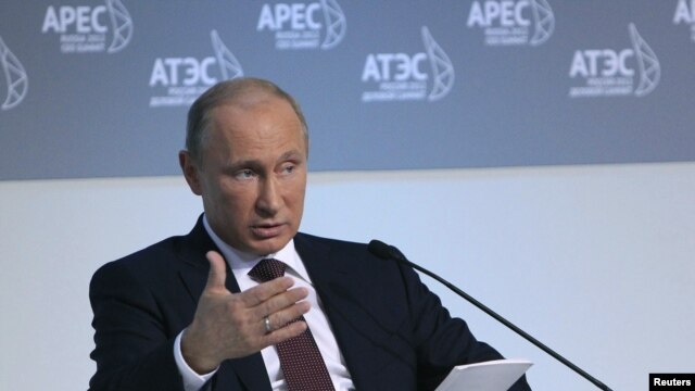 Russian President Vladimir Putin addresses international businessmen gathered ahead of the APEC summit in the eastern Russian port city of Vladivostok on September 7.