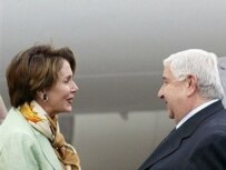 Syrian Foreign Minister Walid al-Muallim (right) welcomes Pelosi to Damascus today (AFP)