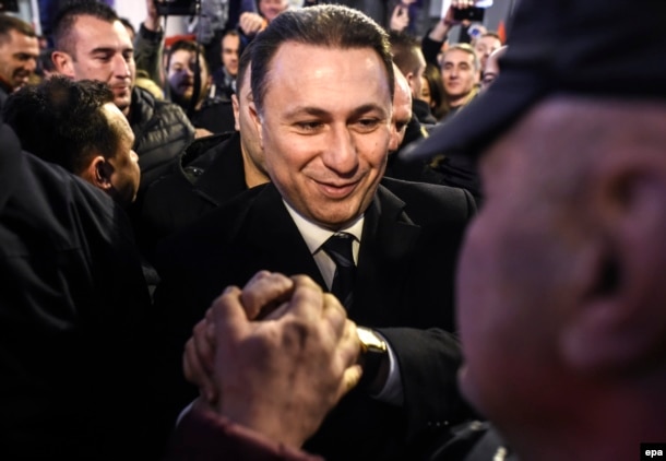 Former Macedonian prime minister and leader of the conservative VMRO-DPMNE party Nikola Gruevski celebrates elections results with supporters in Skopje on December 12.