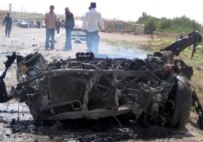 The smoldering remains of the vehicle used in a suicide attack in Herat today (epa)