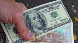 The official rate: $1 equals 1,980 Uzbek soms