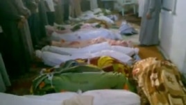 A video grab purportedly shows the bodies of men who were killed in a massacre in the central town of Tremseh.