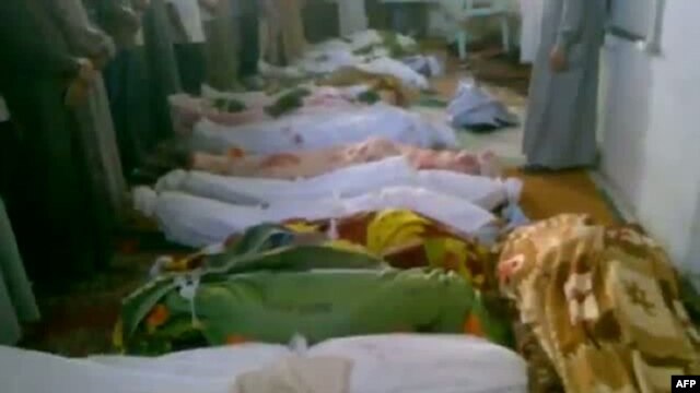 A video grab allegedly shows bodies of men who were killed in a reported massacre in the Syrian village of Tremseh on July 12.