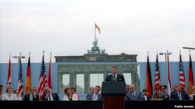 U.S. President Ronald Reagan speaks in front of the Brandenburg Gate and the Berlin Wall on June 12, 1987.