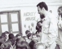 Al-Makdah greeting children at the Ain Al-Hilwah refugee camp in October 2001 (RFE/RL)