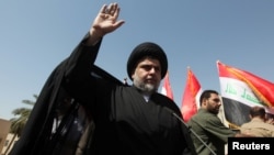 Iraqi Shi'ite cleric Moqtada al-Sadr appeared briefly at the demonstration in Baghdad.