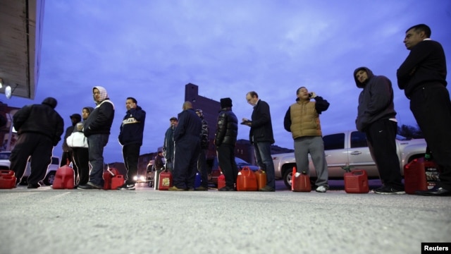 People wait for gas at a Hess fueling station in Brooklyn on November 2.