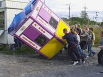 A kiosk being overturned during the riots (ITAR-TASS)