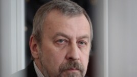 Andrey Sannikau in a Minsk court during his trial in April