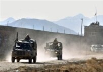 British vehicles on perimeter of Pul-e Charkhi Prison on 26 February (AFP)