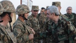 Nagorno-Karabakh - Armenian President Serzh Sarkisian shakes hands with soldiers on frontline duty, 22Oct2012.
