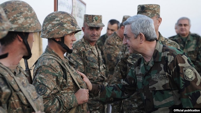 Armenian President Serzh Sarkisian meets with soldiers on frontline duty in Nagorno-Karabakh in October 2012.