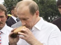President Vladimir Putin examines some bread at an agricultural fair in Rostov-na-Donu last month (TASS)