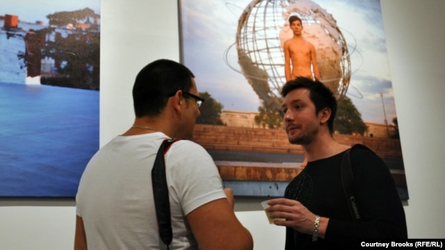 One of Kargaltsev's models, Dmitry (right), stands with another attendee on the exhibition's opening night.