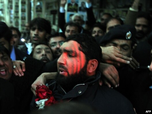 Images of killer Malik Mumtaz Hussain Qadri feted by supporters and garlanded with flowers in custody shocked critics of Pakistan's hard-line religious establishment.