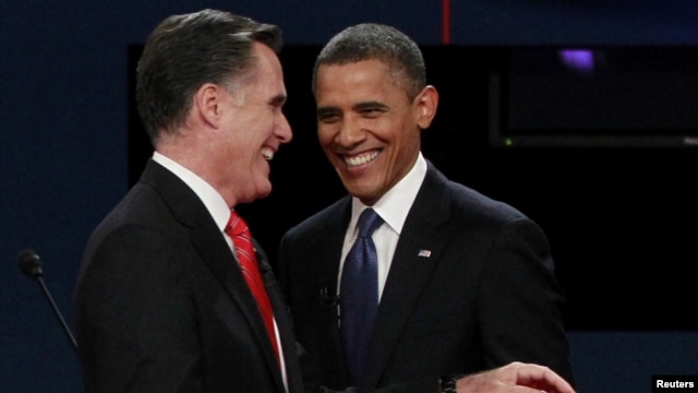 U.S. President Barack Obama (right) and Republican presidential nominee Mitt Romney share a laugh at the end of the first presidential debate.