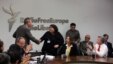 RFE/RL News Director Jay Tolson congratulates Khadija Ismayilova of RFE/RL