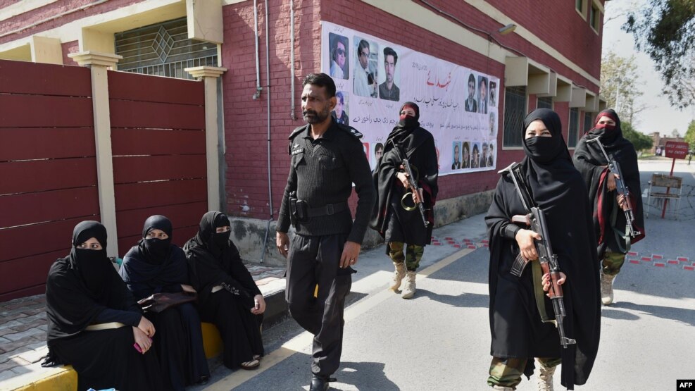 Pakistani police commandos patrol Bacha Khan university after an attack in February 2016