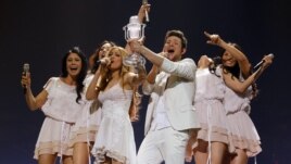 Ell and Nikki of Azerbaijan celebrate on stage after winning the Eurovision Song Contest final in Duesseldorf in May 2011.