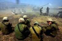 Israeli soldiers fire shells at targets in Lebanon (epa)