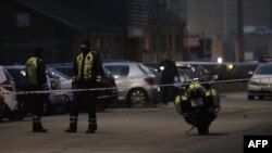 Policemen secure the area around a building in Copenhagen, Denmark, where shots during a debate on Islam and free speech.