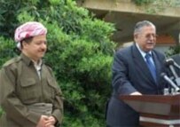 Mas'ud Barzani (left) listens while Iraqi President Jalal Talabani speaks to reporters in April (epa)