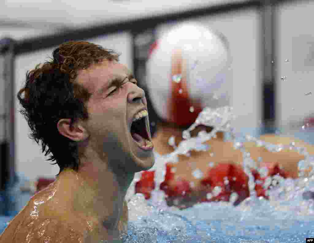 Russia's Denis Tarasov reacts to winning a men's 50-meter swimming freestyle final.