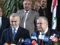 Al-Hashimi (left) with Iraqi President Jalal Talabani at a Baghdad press conference (file photo) (RFE/RL)
