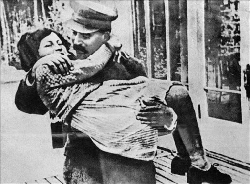 An undated photo of Soviet dictator Joseph Stalin playing with his daughter, Svetlana (AFP)