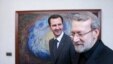 Syrian President Bashar al-Assad (left) meets in Damascus with Ali Larijani, Iran's parliament speaker, on December 21.
